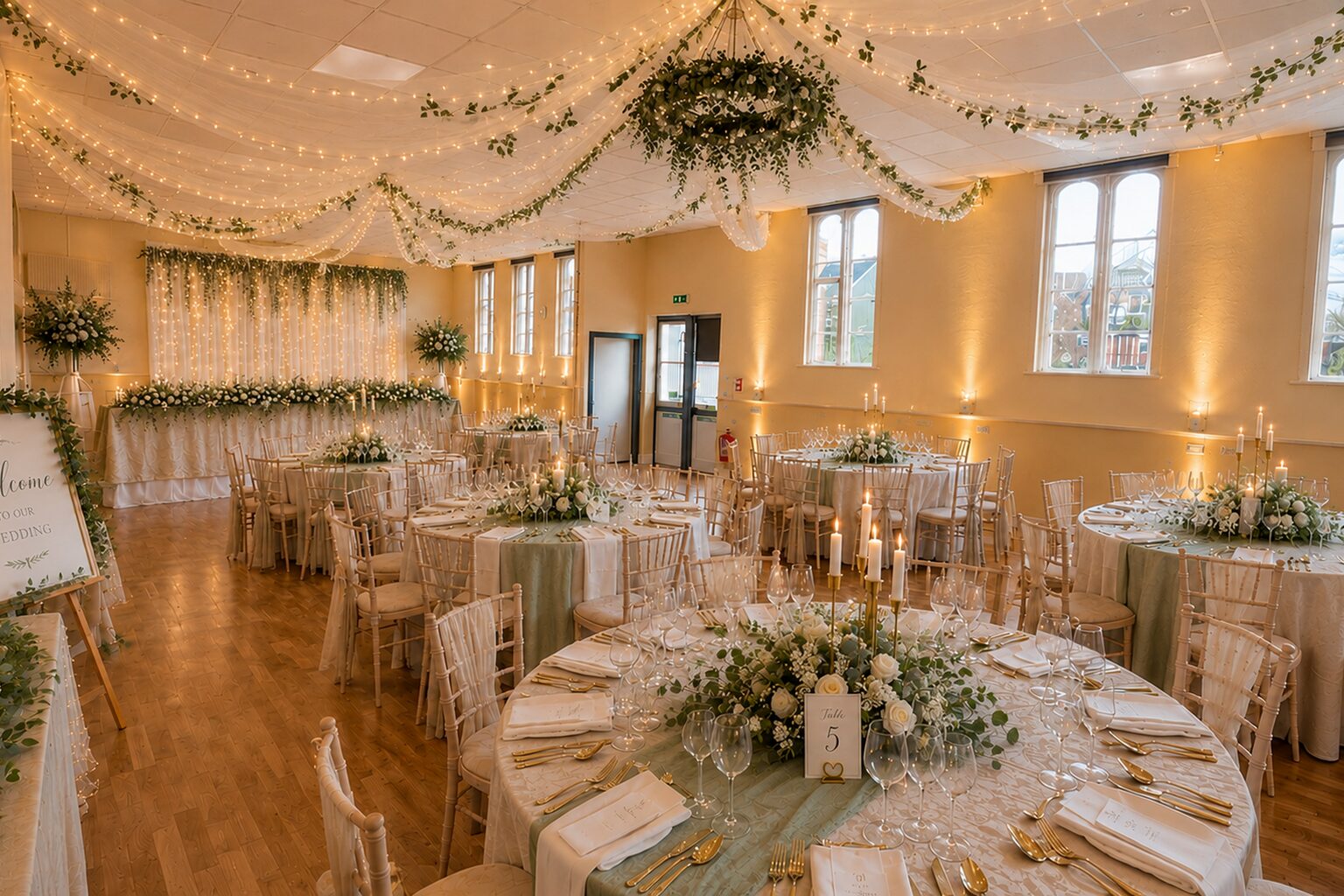 Greenwich Suite 1536x1024 compressed west room with tables prepared for a wedding